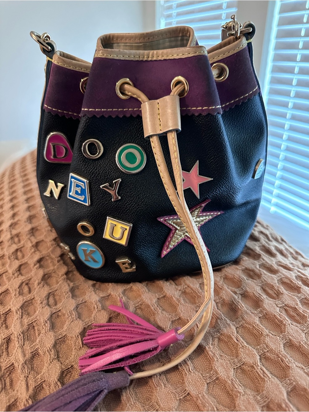 Dooney & Bourke Black Leather Drawstring Bucket Bag with Colorful Letter Charms